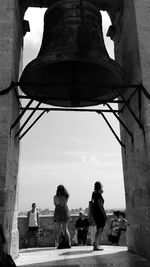 People by bell tower at valencia cathedral