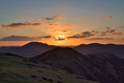 Scenic view of mountains against sky during sunset