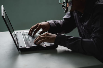 High angle view of man using laptop