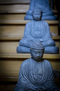 Statue of buddha against building