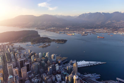 High angle view of buildings by sea against sky