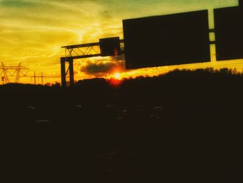 Silhouette of building at sunset