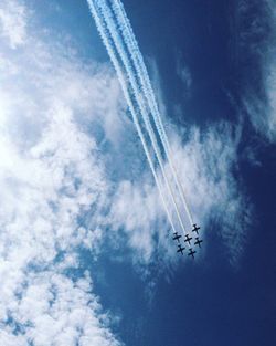 Low angle view of airshow in sky