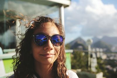 Portrait of young woman wearing sunglasses