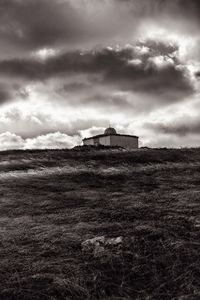 House on field against sky