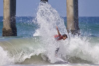 Man splashing water in sea