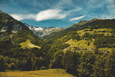 Scenic view of tree mountains against sky