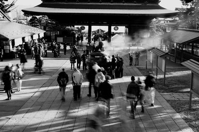 People walking on street in city