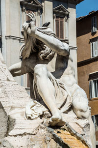 Low angle view of statue of historic building
