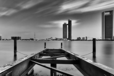 View of bridge over river against buildings