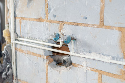 Demolition of an old bathroom with removal of the tiles and exposure of the water and drainage pipes