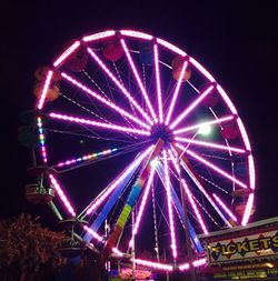 Low angle view of illuminated ferris wheel