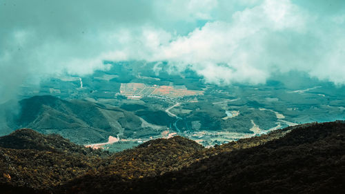 Aerial view of landscape and mountains against sky