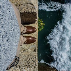 Low section of woman standing in water