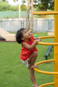 Side view of girl playing in park