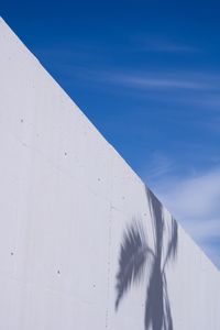 Low angle view of white wall against sky