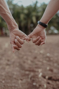 Image of couple holding hands together forever