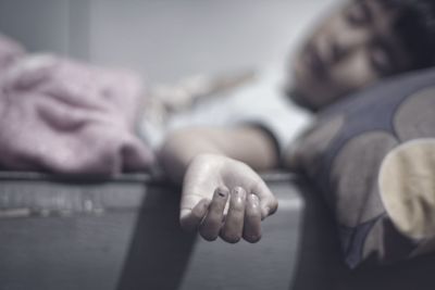 Close-up of boy sleeping on bed