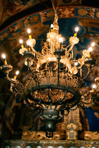 Low angle view of illuminated chandelier