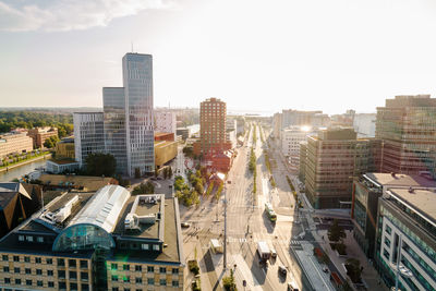 High angle view of vehicles on road in city against sky