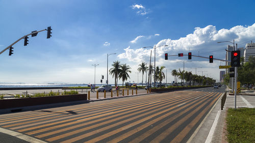 Panoramic view of vehicles on road against sky