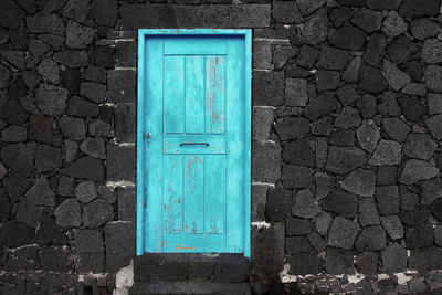 Blue closed door of building