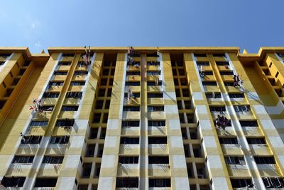 Low angle view of building against sky on sunny day at rochor centre