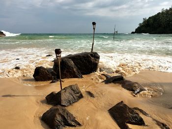 Scenic view of sea against cloudy sky