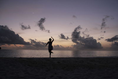 Silhouette of person standing on beach