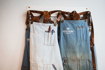 Aprons hanging on wall