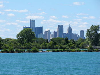 City skyline against cloudy sky