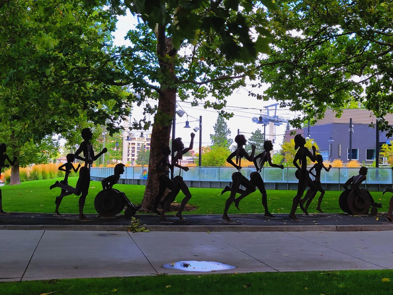 PEOPLE IN PARK BY STREET