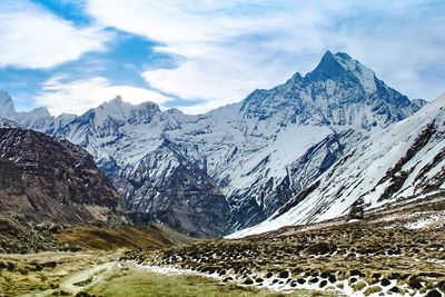 Scenic view of snowcapped mountains against sky