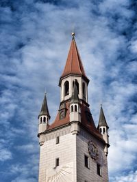 Low angle view of church against cloudy sky