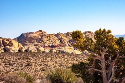 Low angle view of mountain against clear blue sky