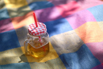 High angle view of drink in jar on blanket