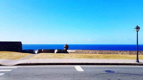 Scenic view of sea against clear blue sky