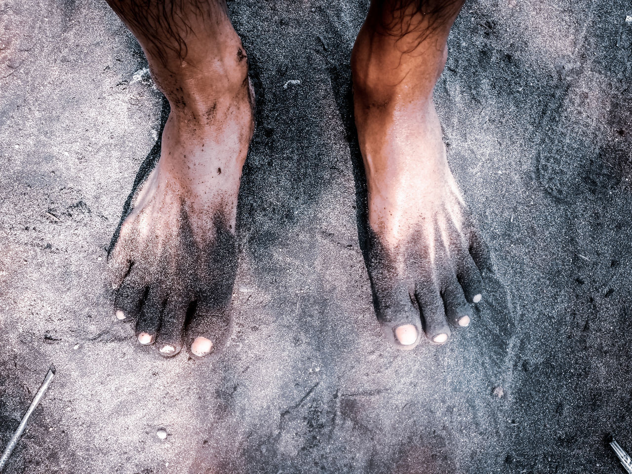 LOW SECTION VIEW OF MAN STANDING ON FLOOR