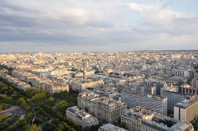 Aerial view of residential district against cloudy sky