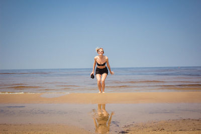 Portrait of young woman on beach