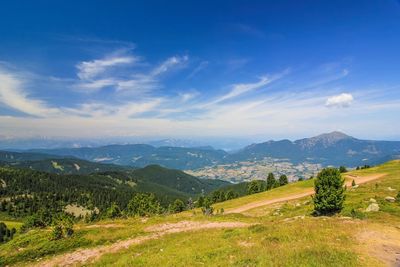 Scenic view of landscape against cloudy sky