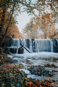 Waterfall in forest during autumn