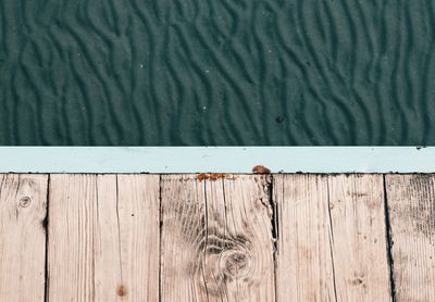 Close-up of wood against water