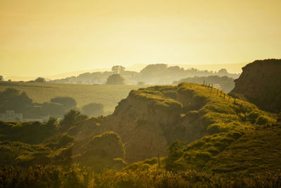 Scenic view of landscape against sky during sunset