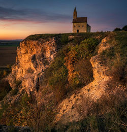 Church on a hill during sunset