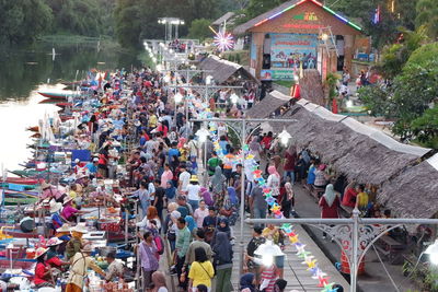 High angle view of people on road against trees