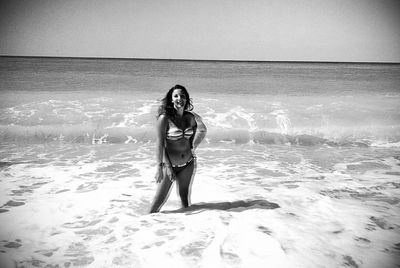 Woman standing on beach