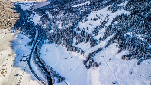 High angle view of snow covered land and mountains