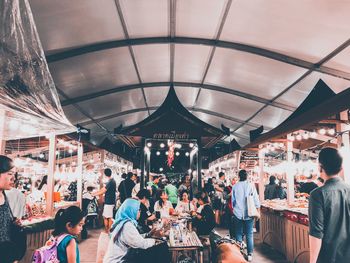 People at market stall