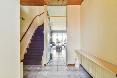 Rear view of woman walking on staircase